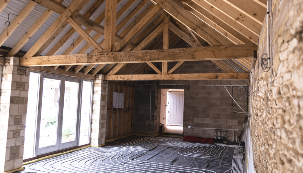 Barn conversion with underfloor heating by Cotswold Building and Roofing Ltd